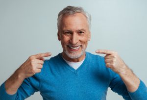 Man With a Beautiful Smile and Dental Crowns