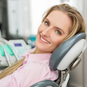 Female patient smiling in the dentist's chair