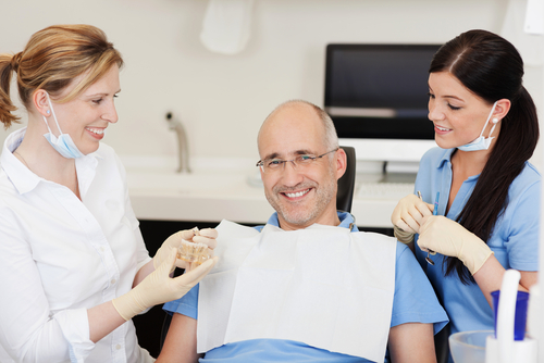 dentists talking to patient