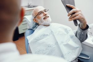 A man examines the results of his general dentistry appointment.